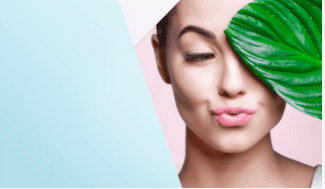 Girl pouting with leaf on the face